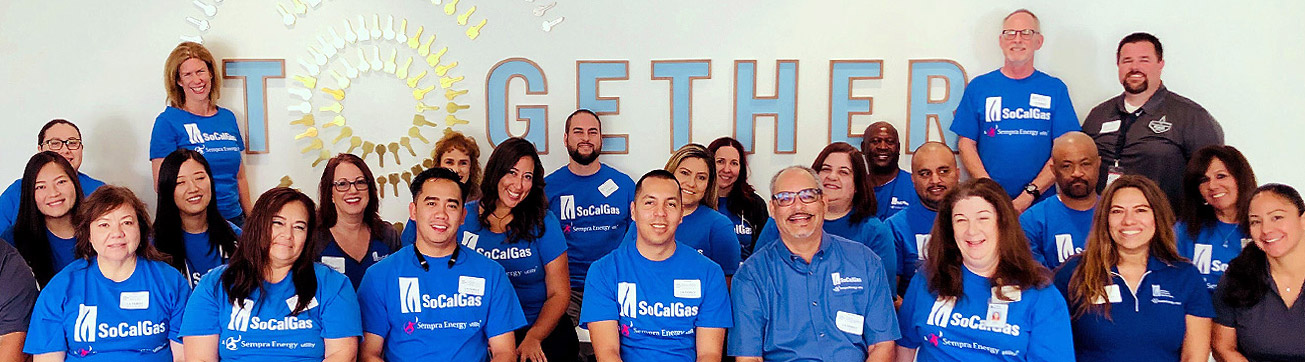 A group of employees smiling.