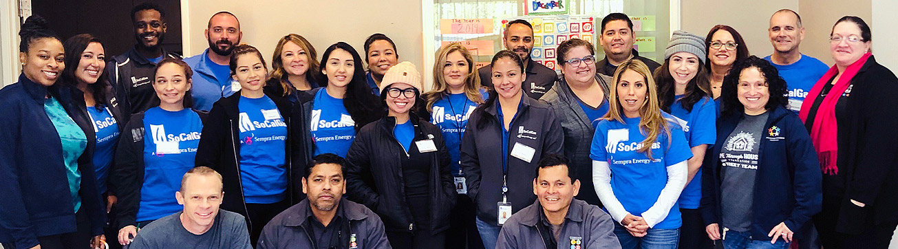 A group of employees smiling.