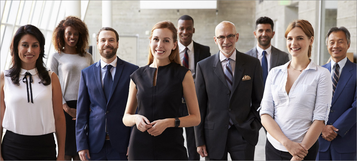 Picture. A group of employees smiling.