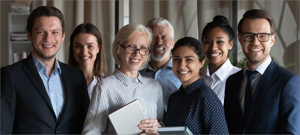 Picture. A group of employees smiling.