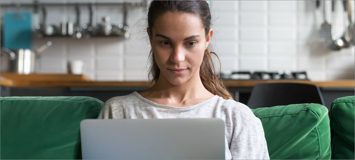 Picture. An employee working on their laptop.