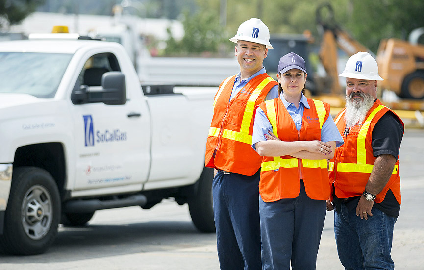 SoCalGas employees standing next to a truck.